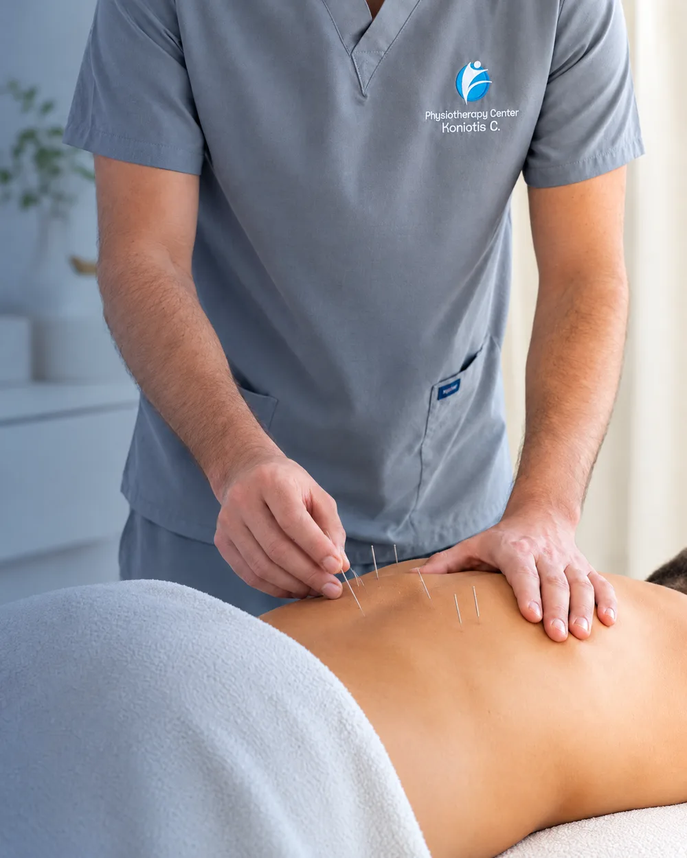 Dry needling on a patient's lower back